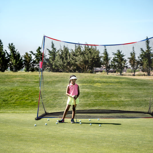 Little girl playing golf with 10' x 7' Golf Practice Hitting Net